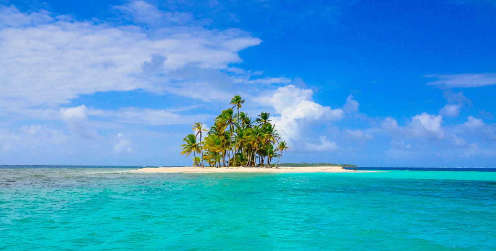 Tropical island with palm trees on the Panama to Colombia boat route