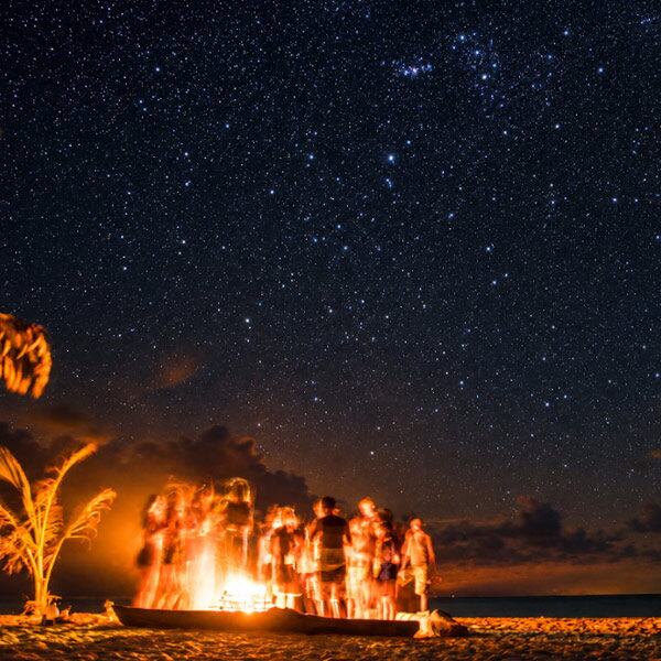 Bonfire on the beach under a starry sky in San Blas